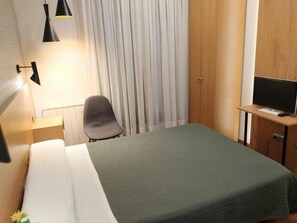 Quarto solteiro | Edredons de pluma, Wi-Fi de cortesia, roupa de cama