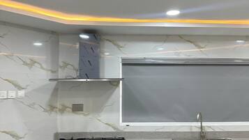 Luxury Apartment, 2 Bedrooms, Kitchenette, Courtyard View | Private kitchen | Mini-fridge, microwave, dishwasher, cookware/dishes/utensils