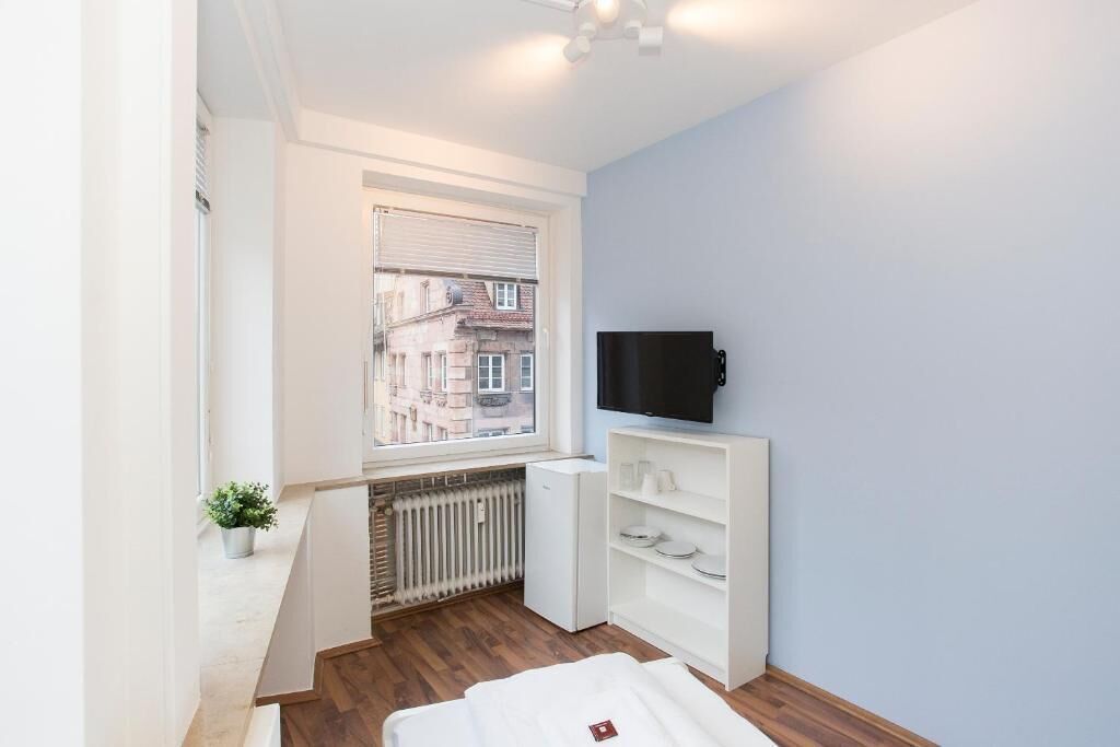 Habitación individual | Tabla de planchar con plancha, wifi gratis y ropa de cama 