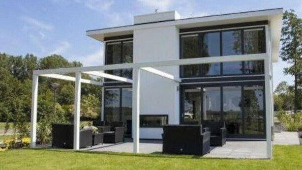 A modern two-story house with a covered patio area. - Cube Magnifique 8 (Nijkerk)