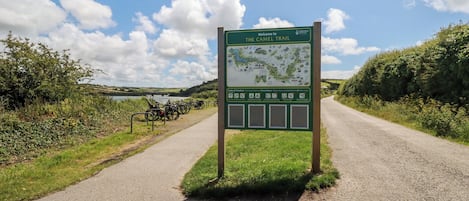 A signboard for The Camel Trail with a map and Code of Conduct.