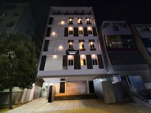 A multi-story building with a sign reading 'TOWNHOUSE & Company Service.' - Premium Super Townhouse Alwal Road (Hyderabad)