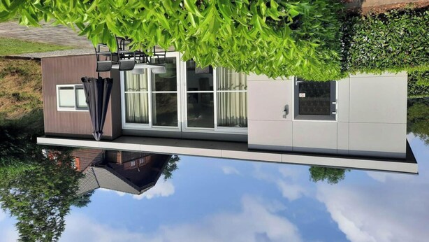 A modern house with a large window, a door, and a small balcony. - Holiday Home in Brunssum With Terrace (Brunssum)