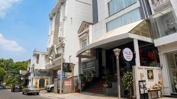 A hotel with a modern design, a prominent entrance, and a visible sign for the KLEI HOTEL.