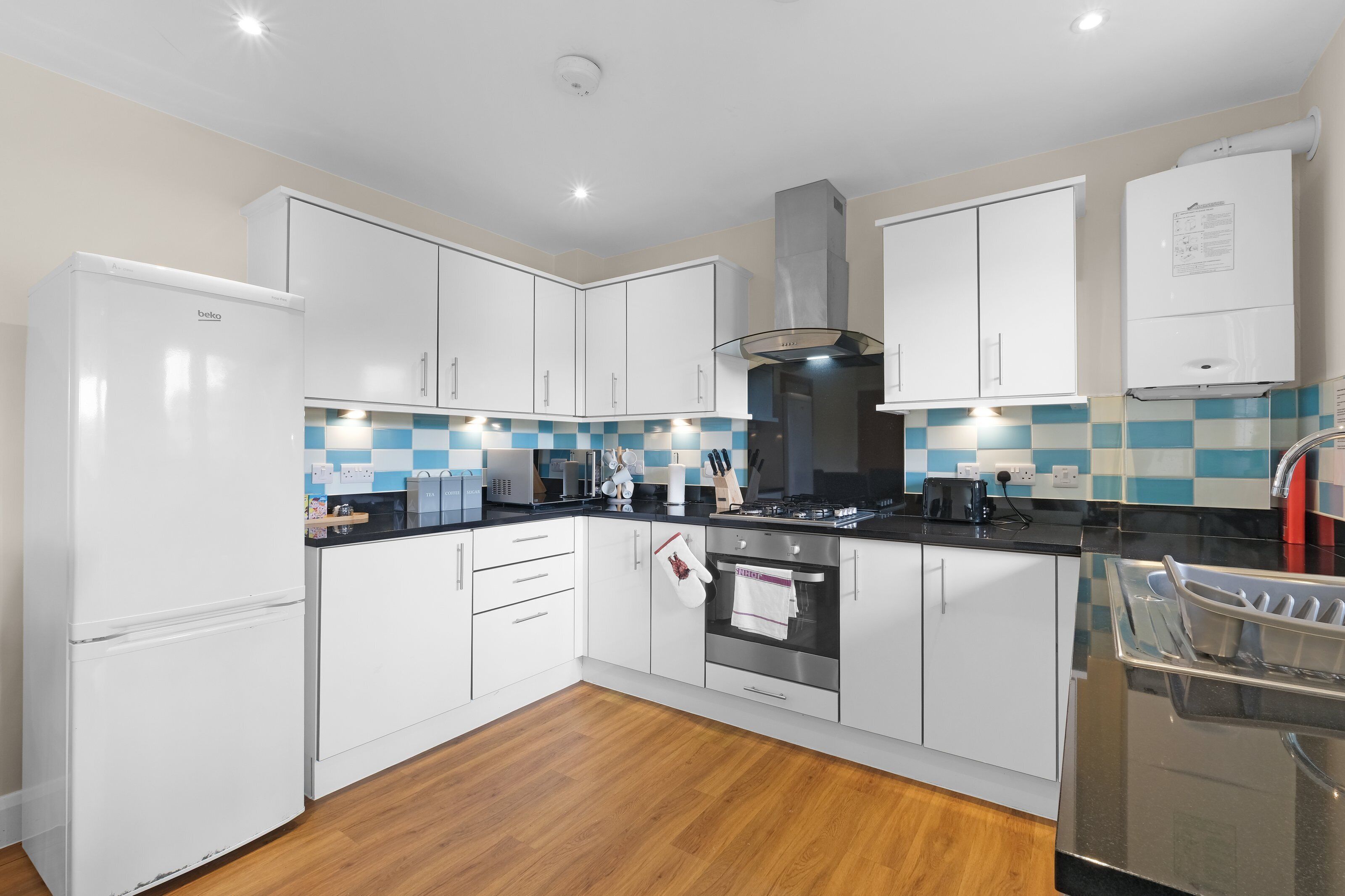 Family Apartment, Balcony | Private kitchen | Toaster, cleaning supplies, freezer, dining table
