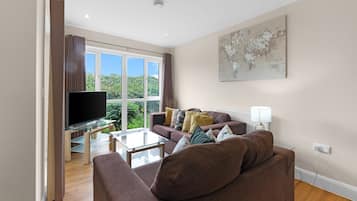 Family Apartment, Balcony | Living area | 42-inch Smart TV with digital channels, Netflix, streaming services