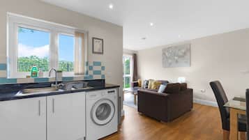 Family Apartment, Balcony | Living area | 42-inch Smart TV with digital channels, Netflix, streaming services