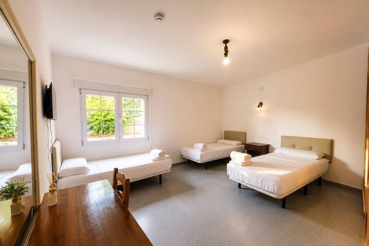 Standard Triple Room, Courtyard View | Desk, laptop workspace, WiFi (free), bed sheets