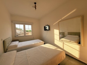 Desk, laptop workspace, WiFi (free), bed sheets