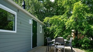 A small, single-story building with a deck and outdoor seating area. - Holiday Home in Amstelveen With Terrace (Amstelveen)