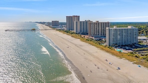A coastal hotel with high-rise buildings, a beach, and a pier. - $150 Free activities - E-gift card when you book- On the ocean | SH105 (Myrtle Beach)