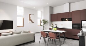Een moderne keuken met een eetgedeelte, een flatscreen televisie en een bank.