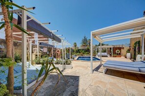 A poolside area with a pergola, lounge chairs, and a small pool. - Gozo Couple Bungalow No 2 · Pool, Cabana, BBQ Deck (Gozo)