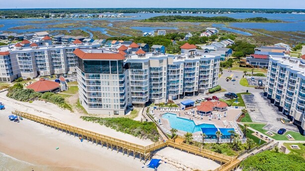 A coastal hotel with multiple high-rise buildings, a beach, and a swimming pool. - 1 Bedroom Overlooking Atlantic Ocean and Swimming Pool (North Topsail Beach)