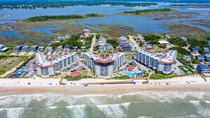 A coastal resort with high-rise buildings, a beach, and a marina. - 1 Bedroom Overlooking Atlantic Ocean and Swimming Pool (North Topsail Beach)