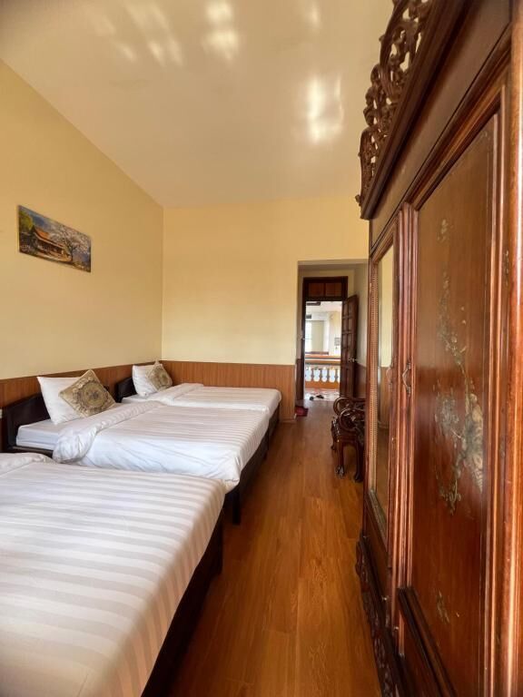 Habitación triple Deluxe, balcón, vista al jardín | Insonorización y wifi gratis 
