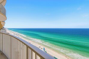 A balcony with a view of a beach and ocean. - Emerald Isle 1805 - JUST COMPLETELY RENOVATED! Beach chair service included! (Panama City Beach)