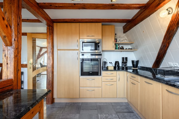 Coffee/tea maker, fridge, microwave, oven
