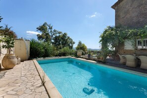 A rectangular swimming pool with clear blue water, surrounded by stone tiles and potted plants. - Holiday Home 'L'écrin Provençal' with Private Pool, Private Terrace and Wi-Fi (Callian)