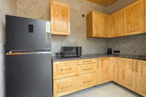 Deluxe Suite | Private kitchen - ELIVAAS Bask and Blessings 1 Room Suites (Anhech)
