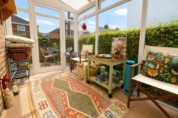 Conservatory with kids play area, mini drinks fridge and leaflets
