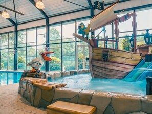 An indoor water park with a pirate ship play area, a duck statue, and a pool. - Holiday Home in Dordrecht With Terrace (Dordrecht)