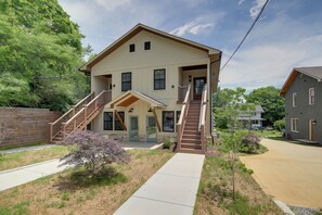 A two-story house with a front porch, a staircase, and a driveway. - Knoxville Extended Base! 3 Mi to Med Center (Knoxville)