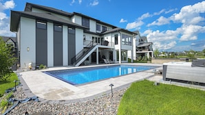 A modern two-story house with a swimming pool, a covered patio, and a large deck area. - Luxe Plymouth Group Getaway w/ Office & Foosball (Plymouth)