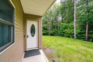 A house with a front door, a window, and a small porch. - Dock & Gym! Lakefront Family Retreat in Lincoln (Lincoln)