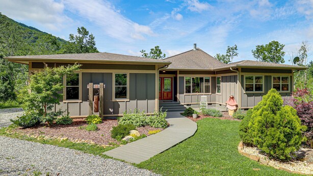 A two-story house with a front porch, a driveway, and a well-maintained garden. - Asheville Mountain Hideaway, 6 Mi to Dtwn (Asheville)