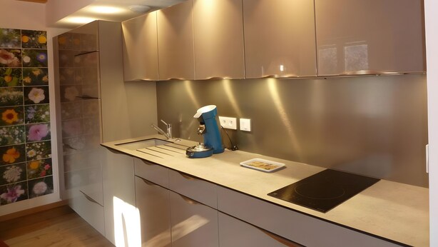 A kitchen with a built-in stove, a sink, and a blue kettle. - Holiday Home 'La Grange De Mediovilla' with Terrace, Private Garden & Wi-Fi (Wingersheim les Quatre Bans)