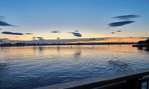 A calm waterfront with a clear sky and distant city skyline. - Dosana Blu Studio 'Aqua Alta' with Wi-Fi and Air Conditioning (Chioggia)
