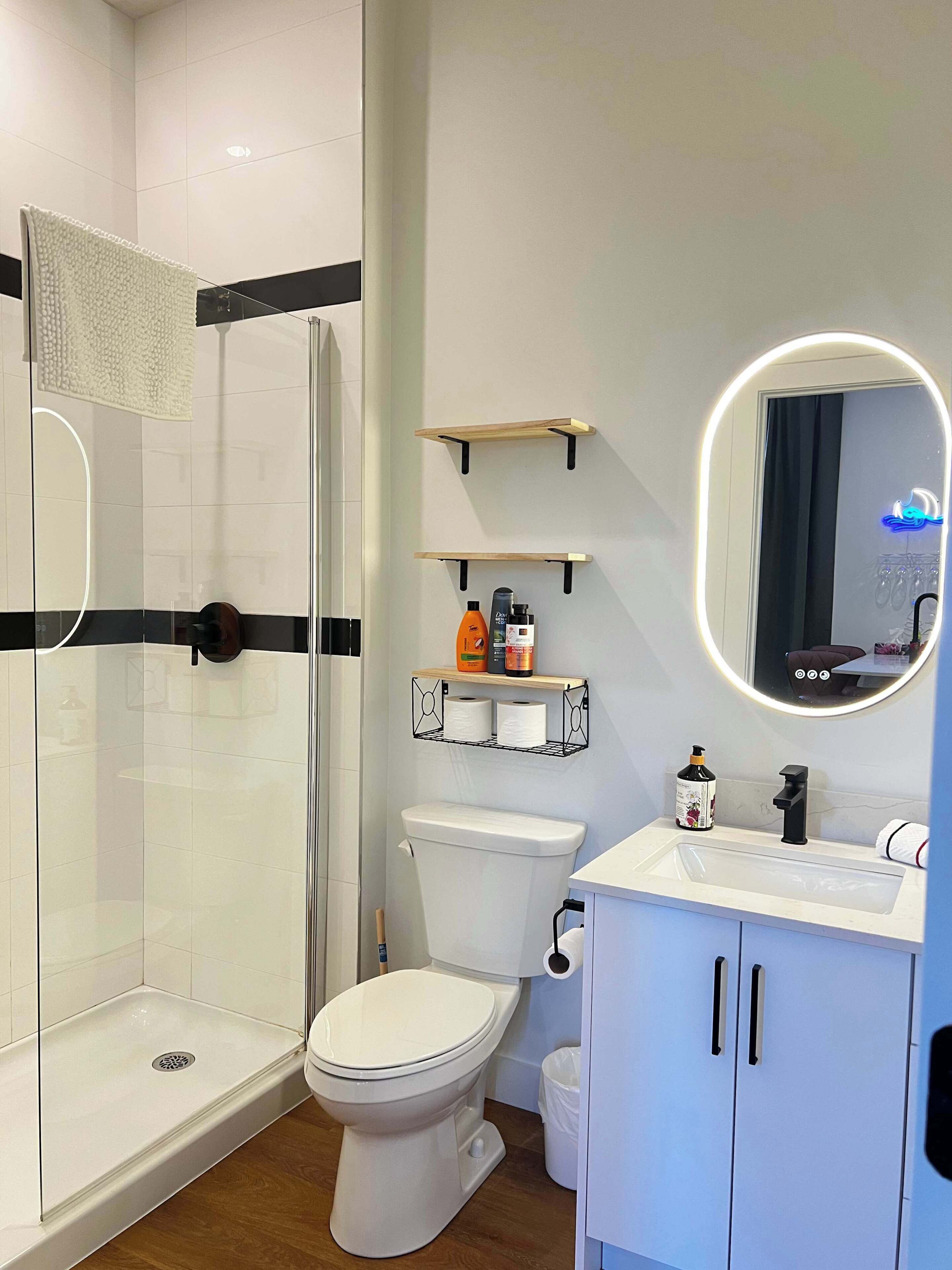 Shower, hair dryer, towels, shampoo