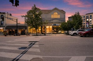 A building with a large glass facade, a visible storefront, and a crosswalk in front. - World Cup 2026 Retreat In The Heart Of Montclair 3 Bedroom Condo (Montclair)