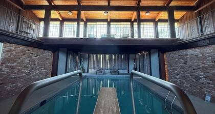 Stylish 60s home with INDOOR POOL on 2 acres