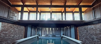 Stylish 60s home with INDOOR POOL on 2 acres