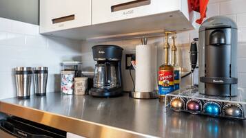 Your fully-equipped kitchen features a Nespresso machine, drip coffee maker, and premium accessories—everything you need to start mornings at your own pace.