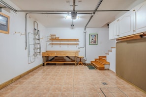 A room with a wooden bench, a ladder, a shelf, and a staircase. - Conde Sunset View (Costa Adeje)