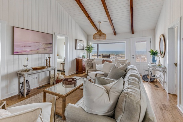 Bright open-concept living room with ocean views