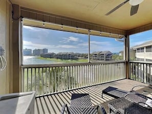A balcony with a view of a body of water and buildings. - Seascape Golf Villas 407 (Miramar Beach)