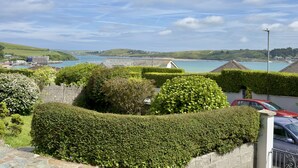 A coastal view with a clear sky, a body of water, and a distant shoreline. - 22 Treverbyn Road  - Spacious Home with amazing estuary views (Padstow)