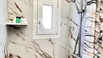 Shower, hair dryer, towels, soap