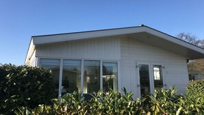 A modern building with large windows and a flat roof. - Holiday Home in Noordwijk With Terrace (Noordwijk)
