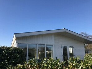 A modern building with large windows and a flat roof. - Holiday Home in Noordwijk With Terrace (Noordwijk)