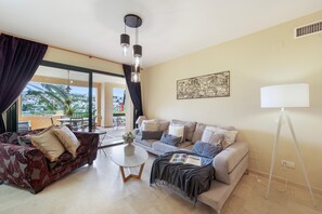 TV - Stylish Atalaya Apartment with Terrace, Pool and Sea Views (El Paraíso)