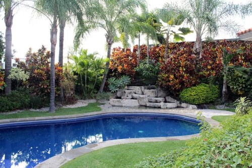 Beautiful Colonial-Style House with a Pool and Green Spaces