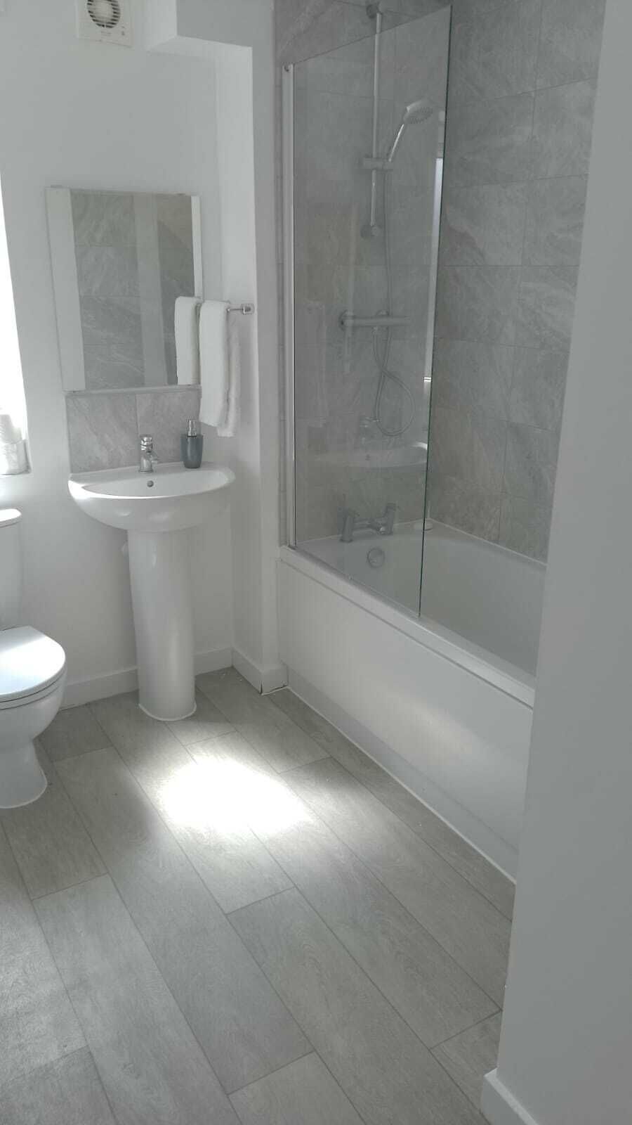 Shower, hair dryer, towels, shampoo