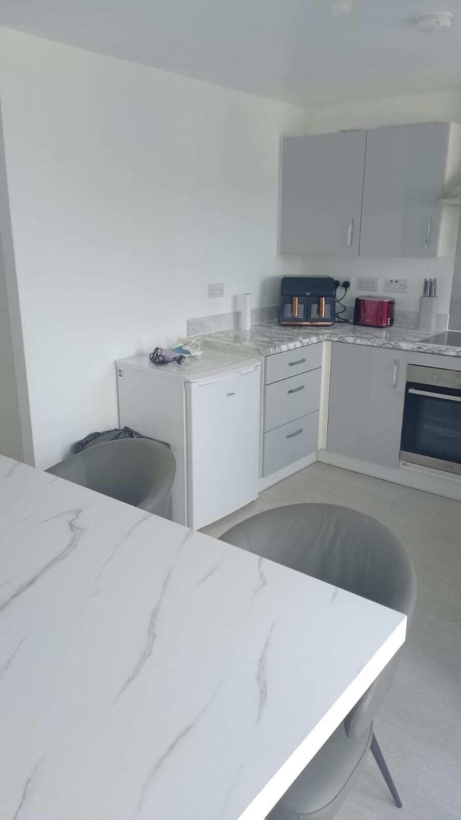Fridge, microwave, stovetop, coffee/tea maker