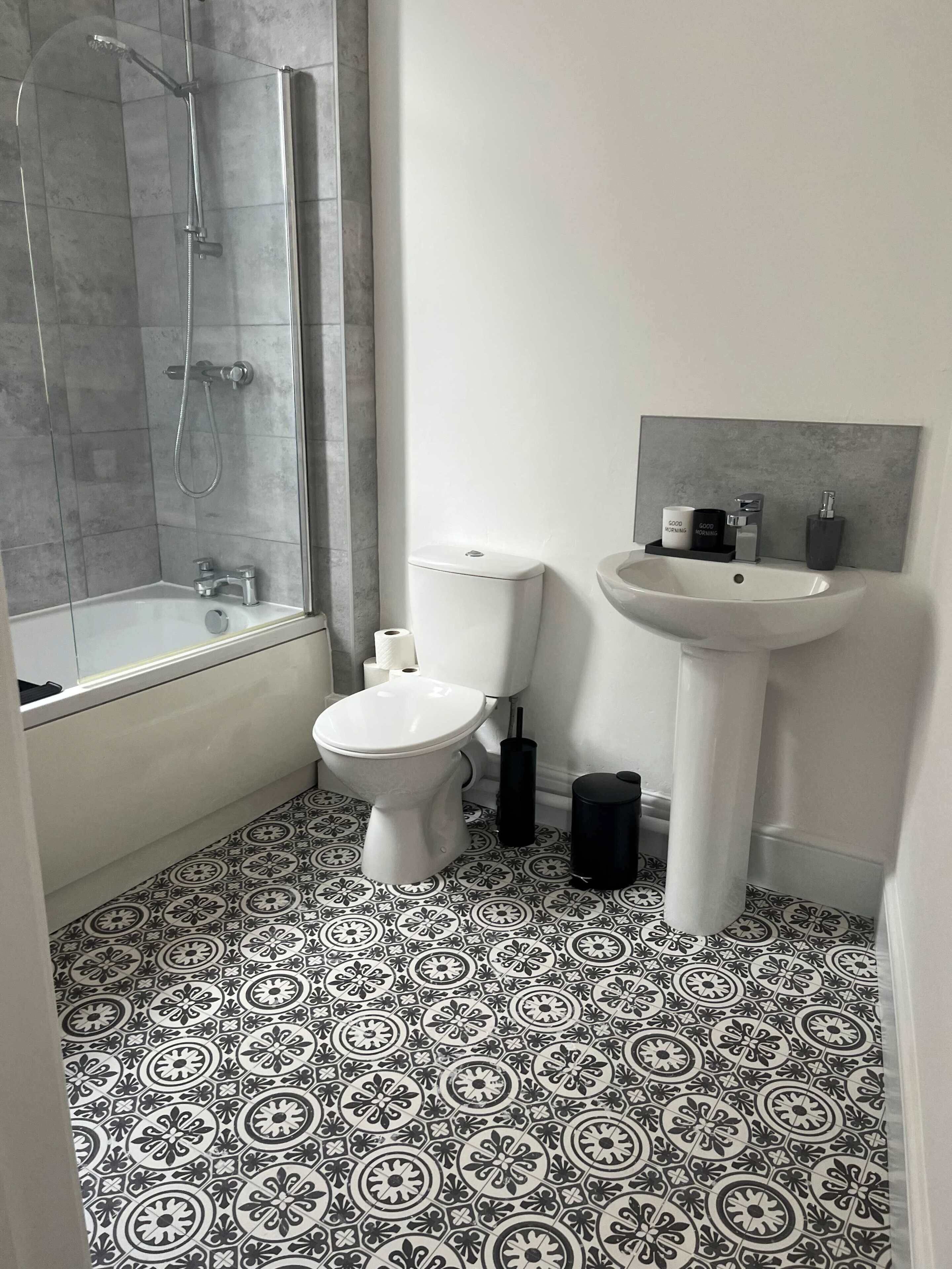 Shower, hair dryer, towels, shampoo