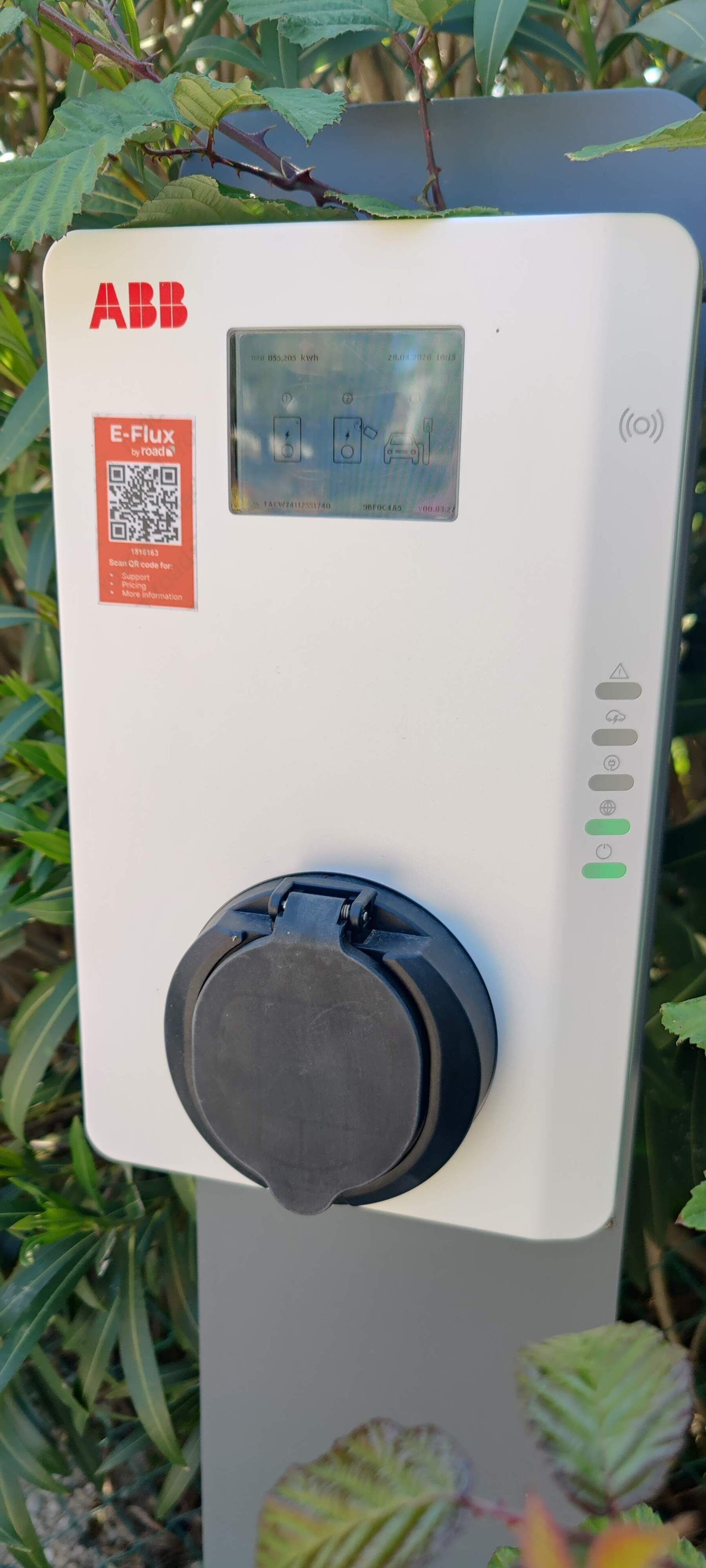 A utility meter with a QR code, a digital display, and a dial.